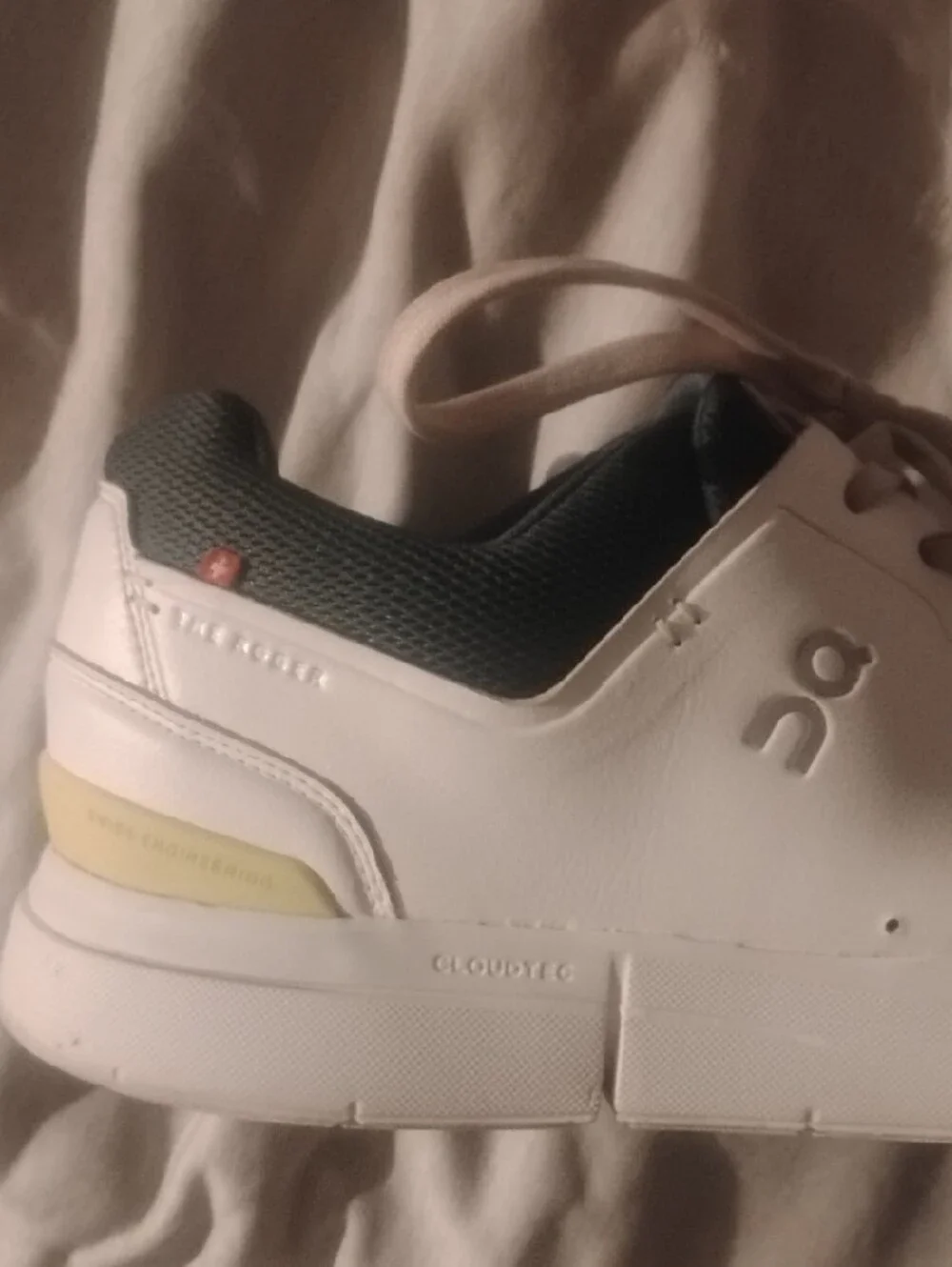 On Running The Roger Navy And White With Yellow Accents Size 11.5